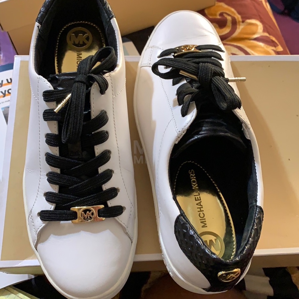 White upper leather style glamorous black Rhinestone accents and hardware logo.